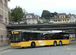 (255'866) - D�nser, Trimmis - GR 106'166/PID 10'166 - MAN am 4. Oktober 2023 beim Bahnhof Spiez